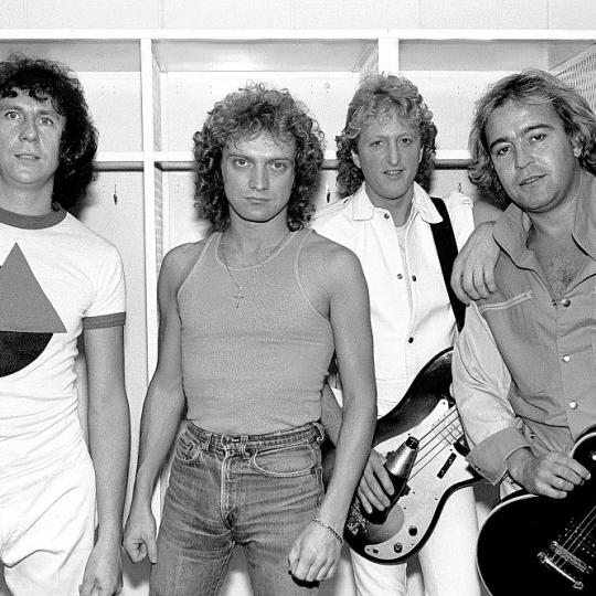 Portrait of the American-based rock band Foreigner as they pose backsatge at the Rosemont Horizon, Rosemont, Illinois, November 8, 1981. Pictured are, from left, Dennis Elliot, Lou Gramm, Rick Wills, and Mick Jones. (Photo by Paul Natkin/Getty Images)