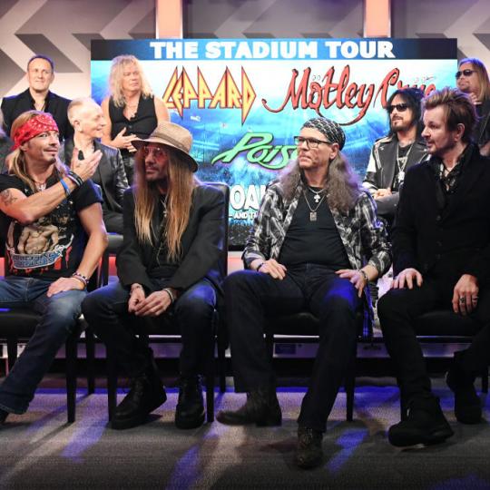 ) Rick Allen, Joe Elliott, Vivian Campbell, Phil Collen, and Rick Savage of Def Leppard, Nikki Sixx, Vince Neil, Mick Mars, and Tommy Lee of Mötley Crüe, and (Front of stage L-R) Bret Michaels, C.C. DeVille, Bobby Dall, and Rikki Rockett of Poison attend the Press Conference with Mötley Crüe, Def Leppard, and Poison announcing 2020 Stadium Tour on December 04, 2019 in Hollywood, California. 