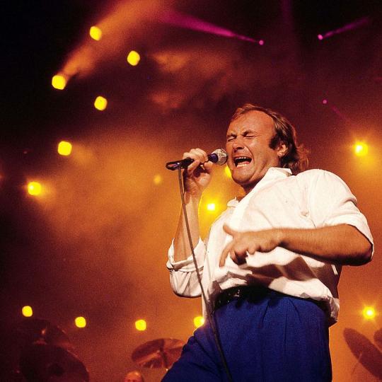 Photo of Phil COLLINS performing live on stage in Sydney, Australia circa 1985. 