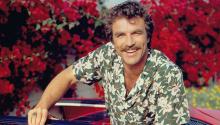 LOS ANGELES - JANUARY 1: Actor Tom Selleck stars as Thomas Sullivan Magnum on the CBS television series "Magnum, P.I." He is in a red Ferrari 308 and wearing a Hawaiian floral print shirt. Image dated January 1, 1984. (Photo by CBS via Getty Images) 