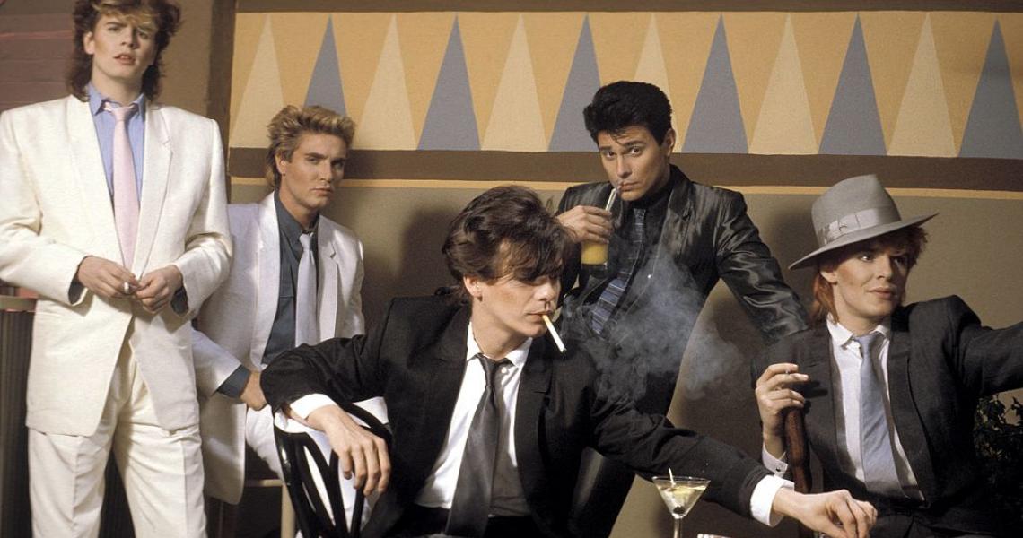 JANUARY 01: Photo of DURAN DURAN; L-R: John Taylor, Simon Le Bon, Andy Taylor (smoking cigarette), Roger Taylor, Nick Rhodes - posed, studio, group shot (Photo by Fin Costello/Redferns)