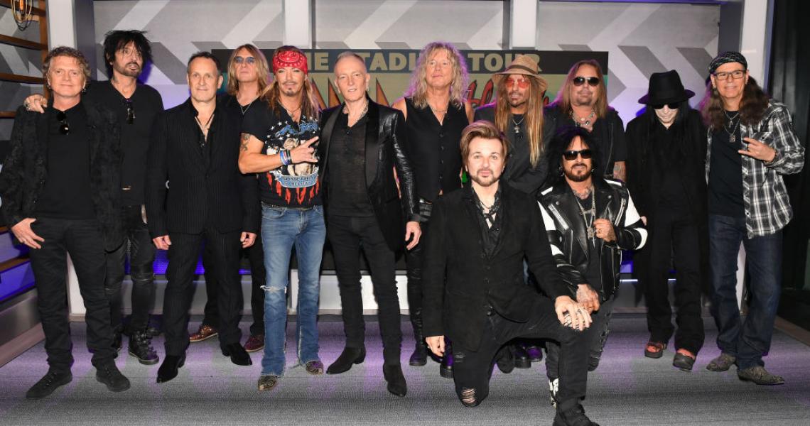  (L-R) Rick Allen, Tommy Lee, Vivian Campbell, Joe Elliott, Bret Michaels, Phil Collen, Rick Savage, Rikki Rockett, C.C. DeVille, Nikki Sixx, Vince Neil, Mick Mars, and Bobby Dall attend the Press Conference with Mötley Crüe, Def Leppard, and Poison announcing 2020 Stadium Tour on December 04, 2019 in Hollywood, California. (Photo by Kevin Winter/Getty Images)