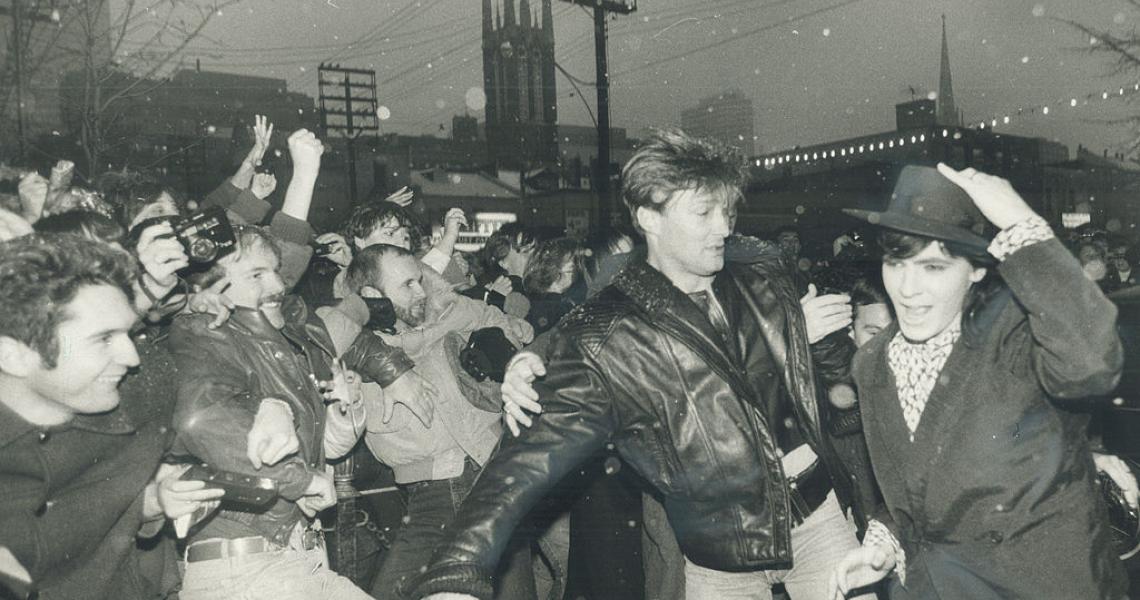 December 1985: Bodyguards restraing fans as Nick Rhodes makes a mad dash into the CITY-TV studios. He was there promoting the Arcadia album (Tony Bock/Toronto Star via Getty Images)